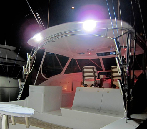 two floodlights illuminating a deck